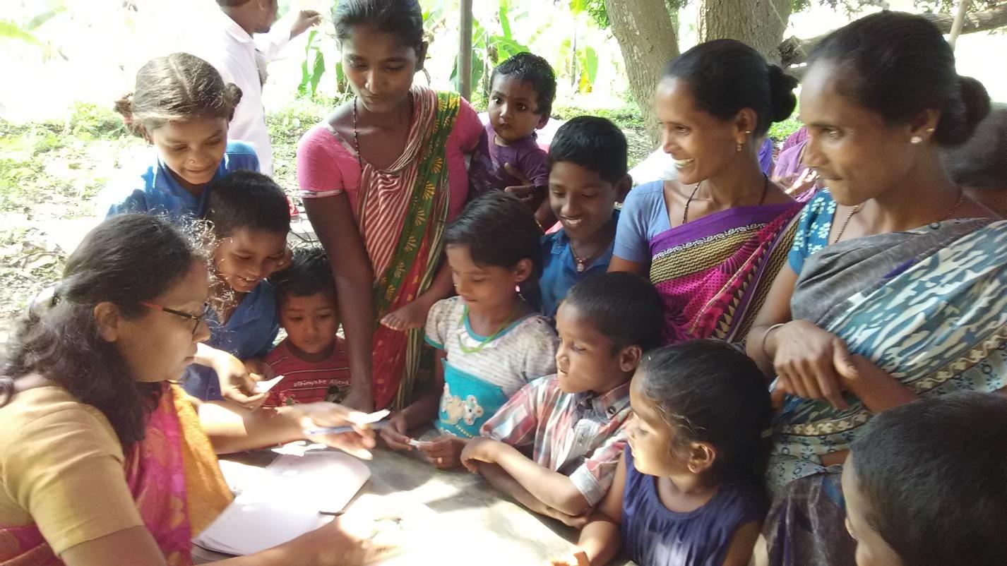 An Indian woman selecting her baptismal name